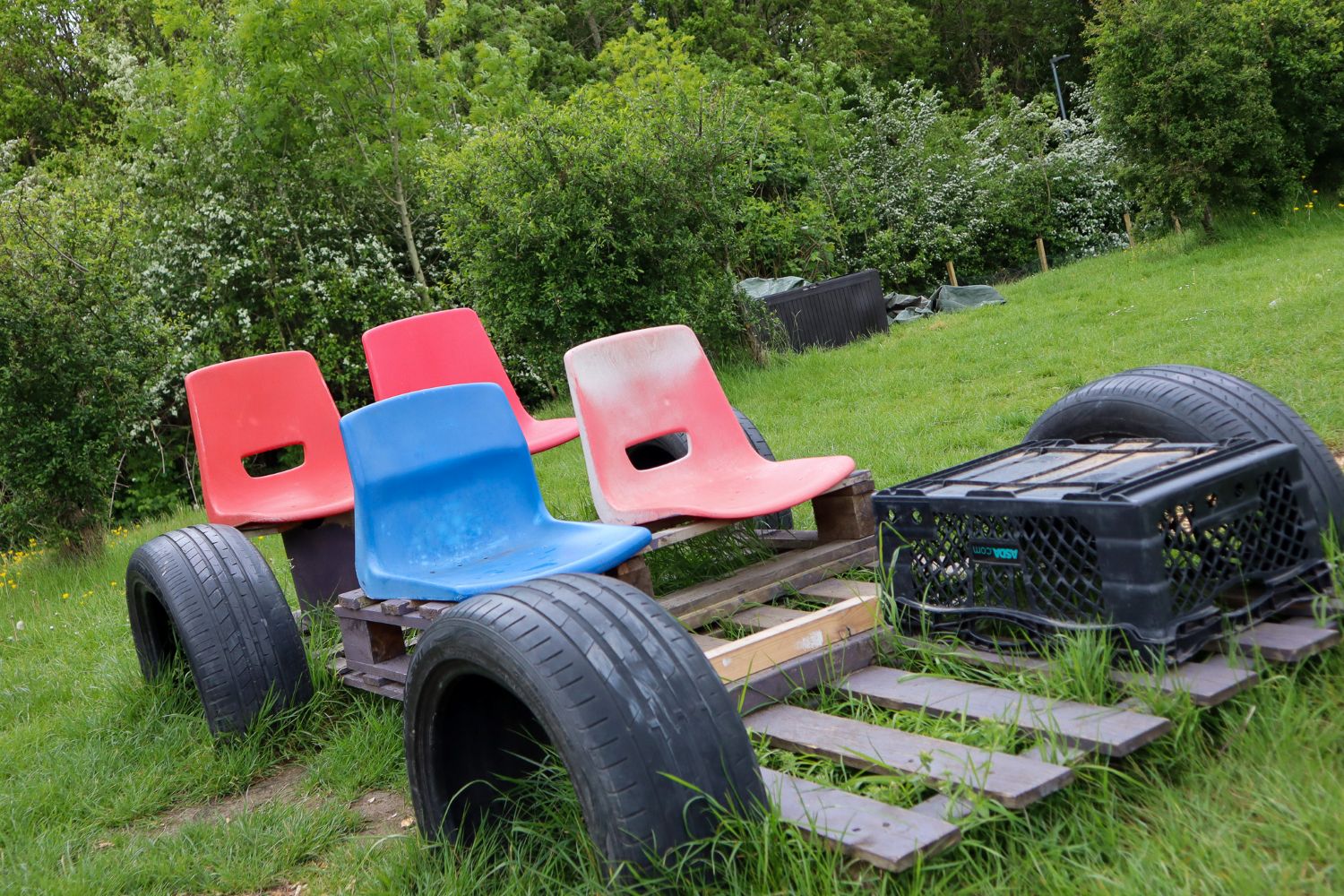 A piece of OPAL play equipment set up like a car