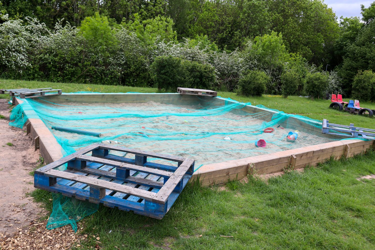 The sand pit used as part of the OPAL play equipment
