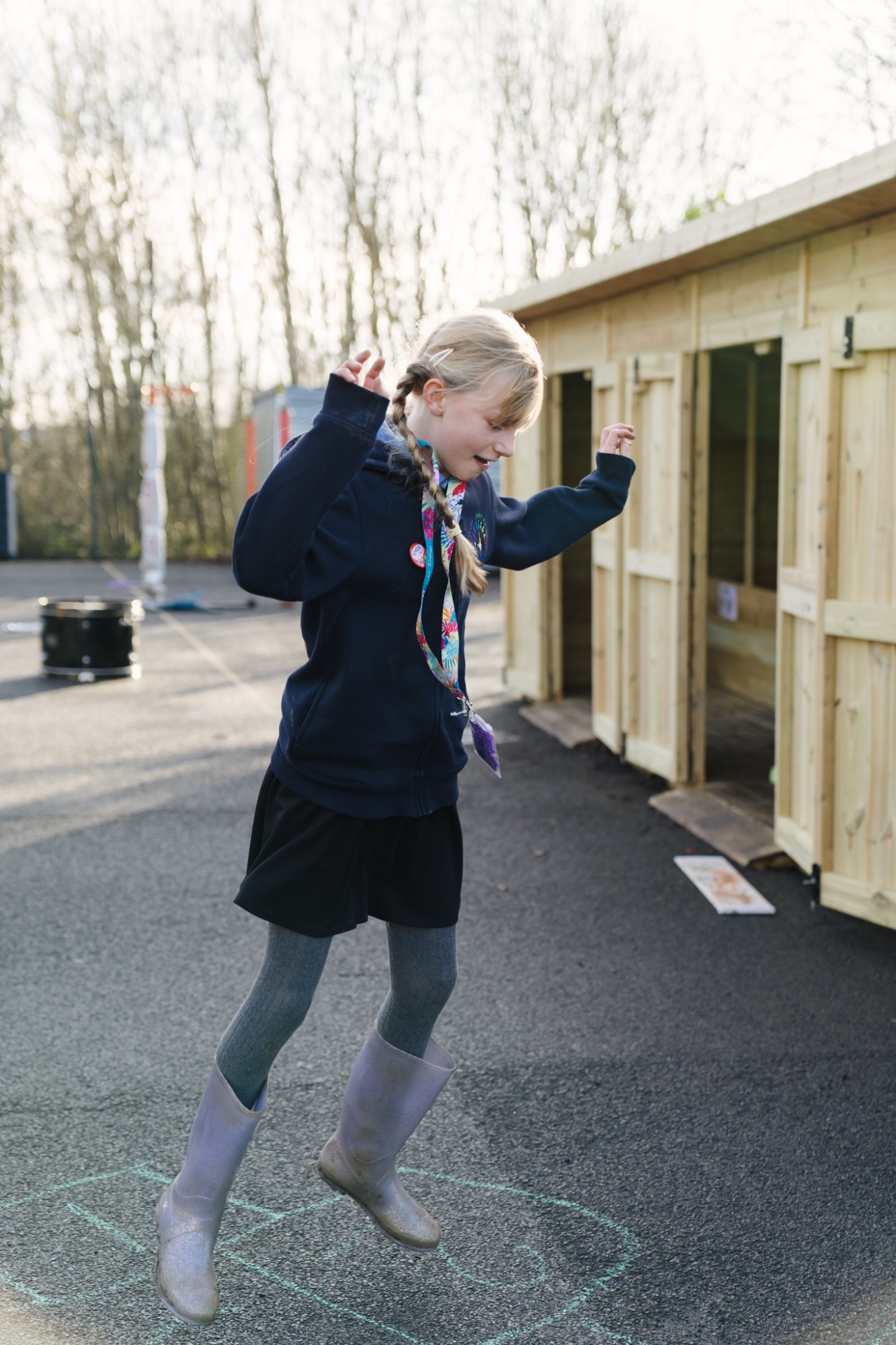 Pupil playing hopscotch